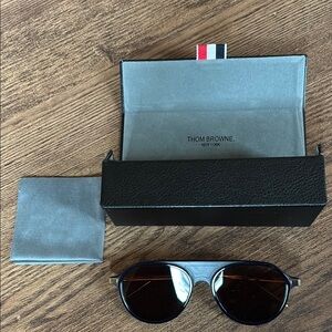 Thom Browne aviator sunglasses. Navy frame with gold details & Brown lenses.